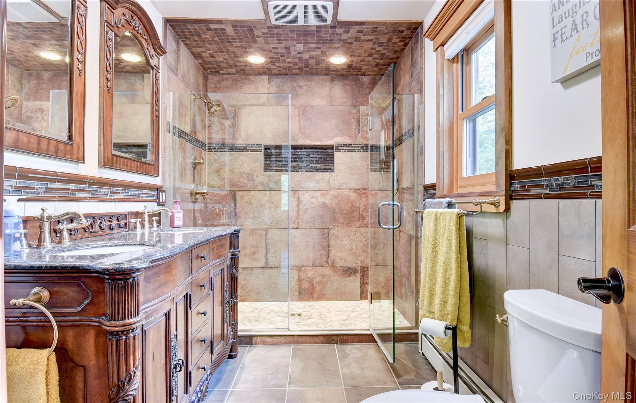 29 Valley View Road Bloomingburg, NY 12721 - Photo 24 of 50 a bathroom with a sink a toilet a mirror and shower