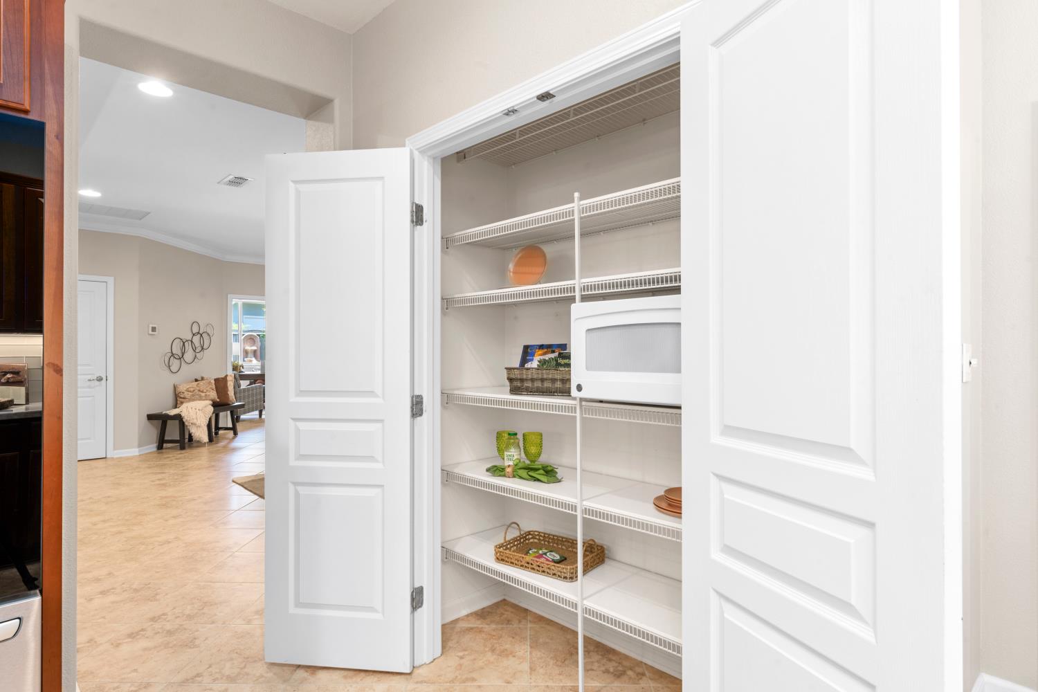 2306 Longspur Loop Lincoln, CA 95648 - Photo 27 of 59 Spacious pantry with double door - microwave is hidden in here