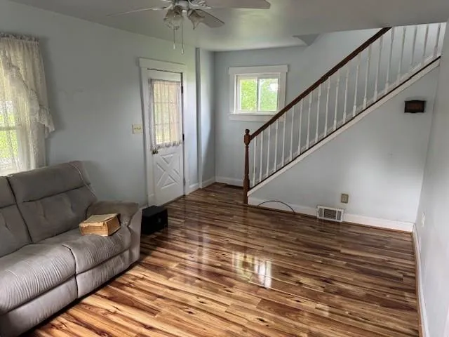 a view of livingroom with furniture and stairs