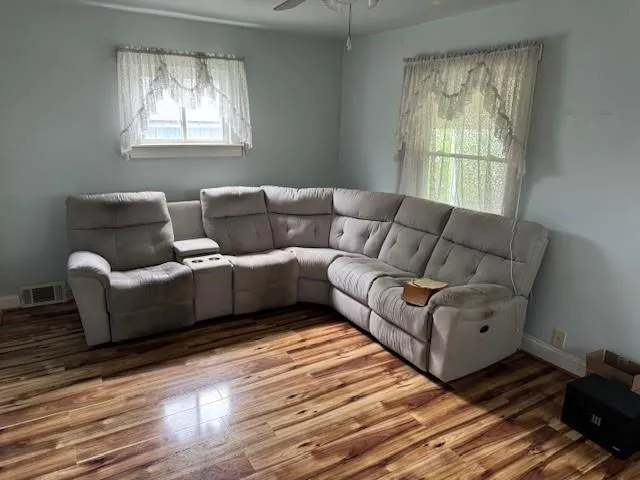 a living room with furniture and a window
