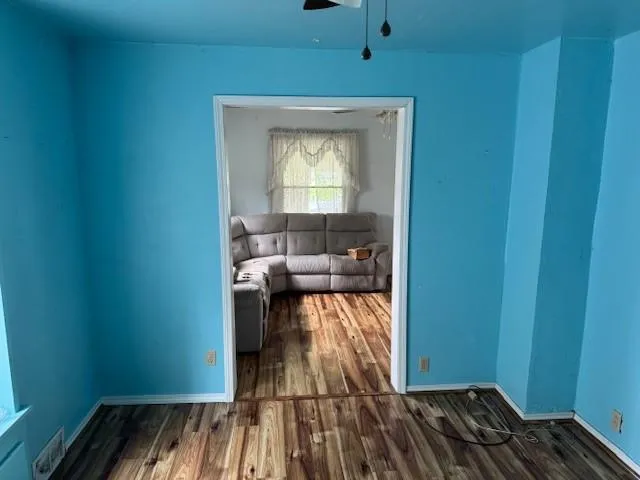 a view of a room that has a bed and a window