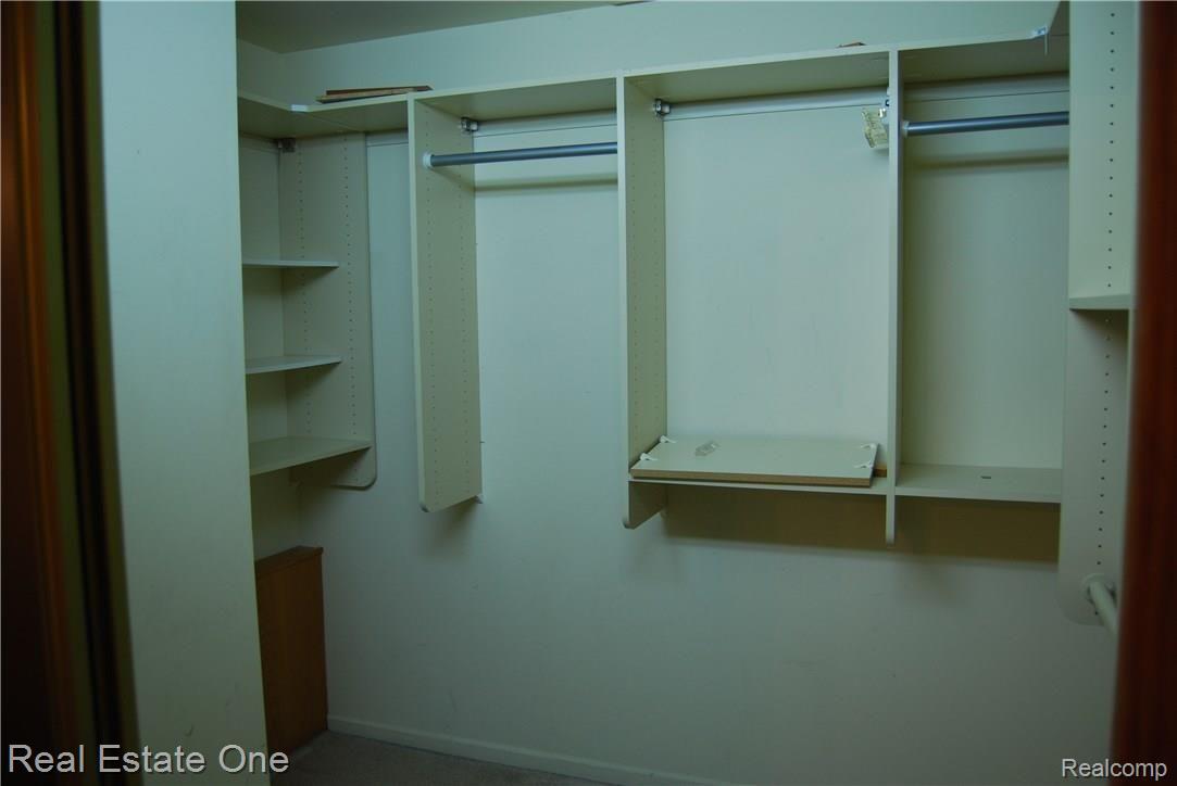 2152 Rochelle Park Drive, Unit 102 Rochester, MI 48309 - Photo 12 of 22 Master Walk-in Closet