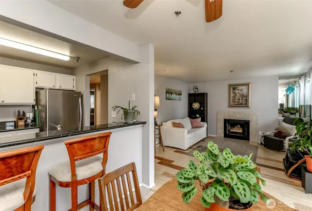 a living room with fireplace furniture and a flat screen tv