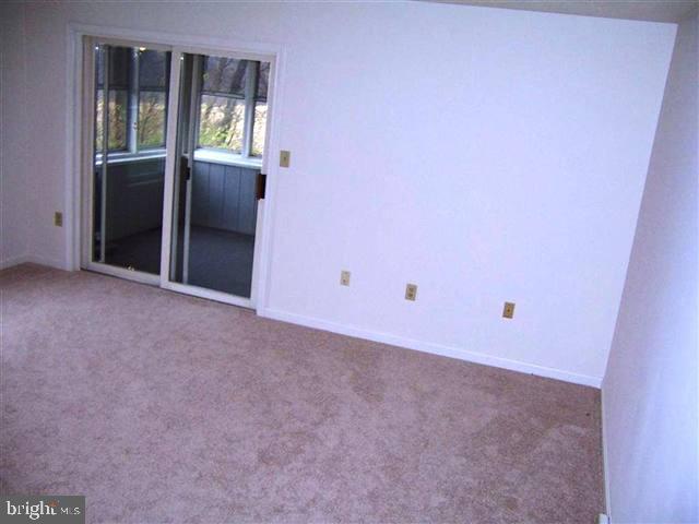 624 Colonial View Road Mechanicsburg, PA 17055 - Photo 5 of 8 a view of an empty room with a window