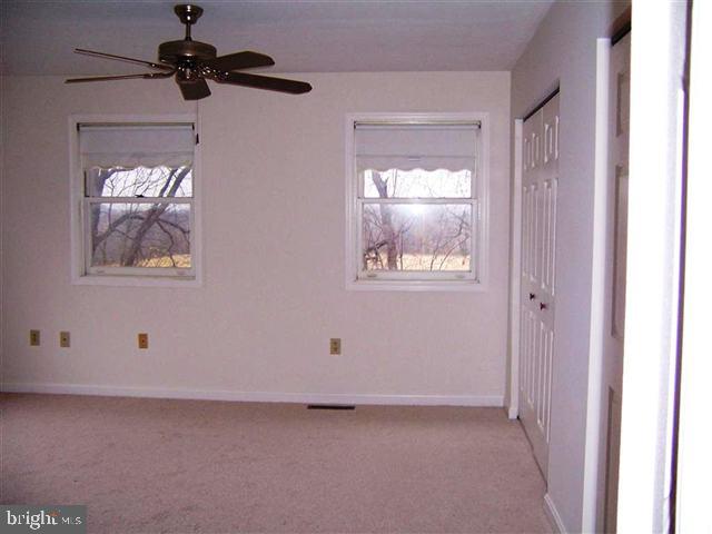 624 Colonial View Road Mechanicsburg, PA 17055 - Photo 6 of 8 a view of an empty room with a window