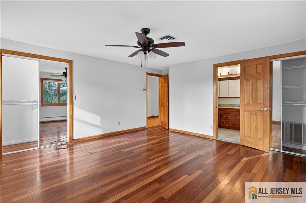 352 Rahway Road Edison, NJ 08820 - Photo 18 of 30 a view of a room with wooden floor and ceiling fan