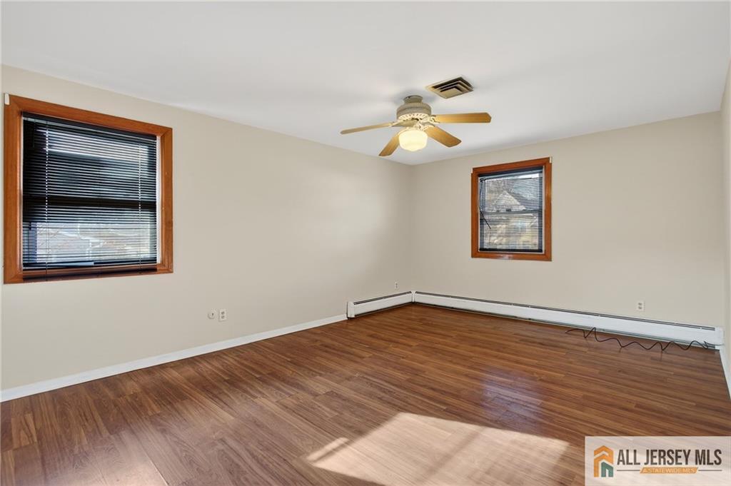 352 Rahway Road Edison, NJ 08820 - Photo 20 of 30 a view of empty room with wooden floor