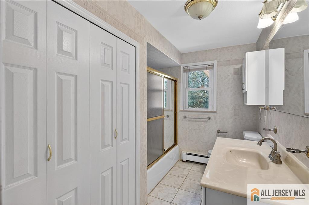 352 Rahway Road Edison, NJ 08820 - Photo 22 of 30 a bathroom with a sink and a shower