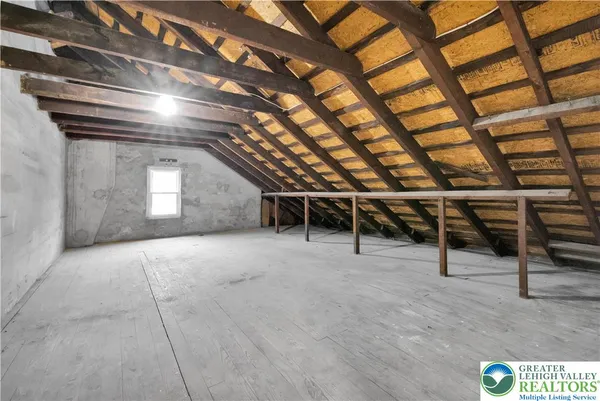 a view of an empty room with stairs