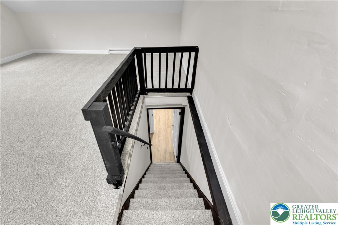 109 North Sixth Street Emmaus, PA 18049 - Photo 8 of 23 a view of staircase with railing and white walls