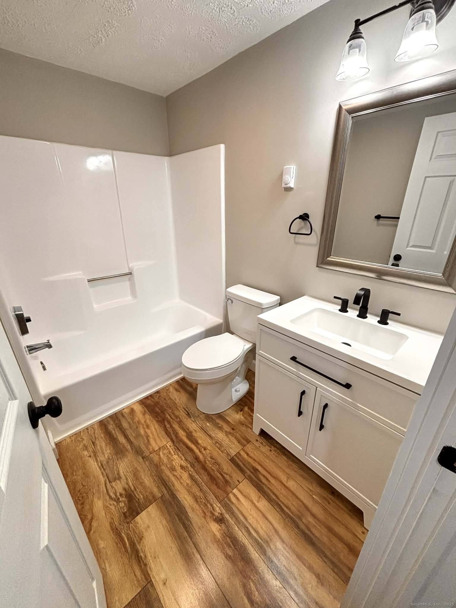 164 Starkweather Road Plainfield, CT 06354 - Photo 14 of 23 a bathroom with a sink mirror vanity and toilet