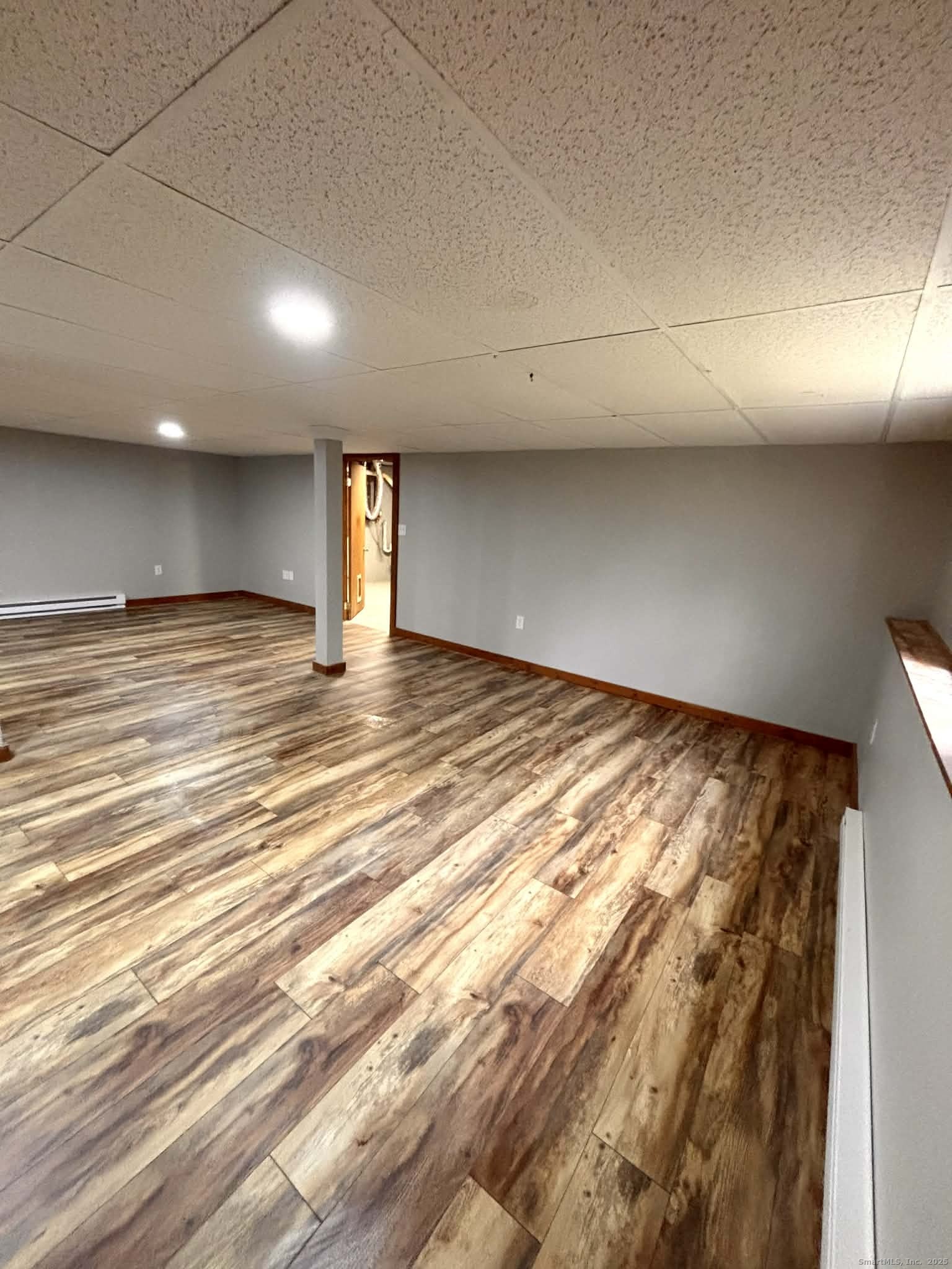 164 Starkweather Road Plainfield, CT 06354 - Photo 18 of 23 an empty room with wooden floor and windows