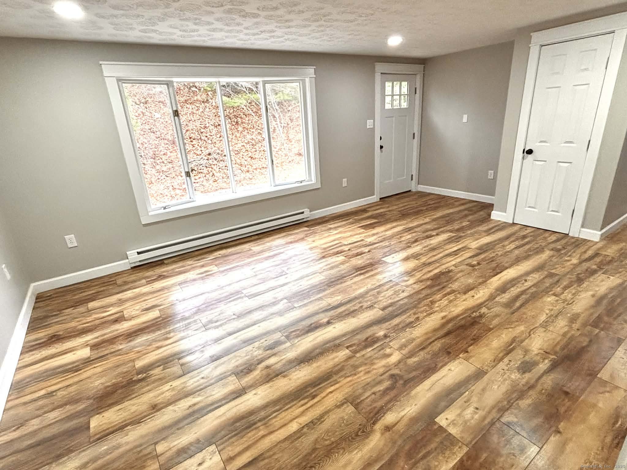 164 Starkweather Road Plainfield, CT 06354 - Photo 6 of 23 a view of empty room with wooden floor
