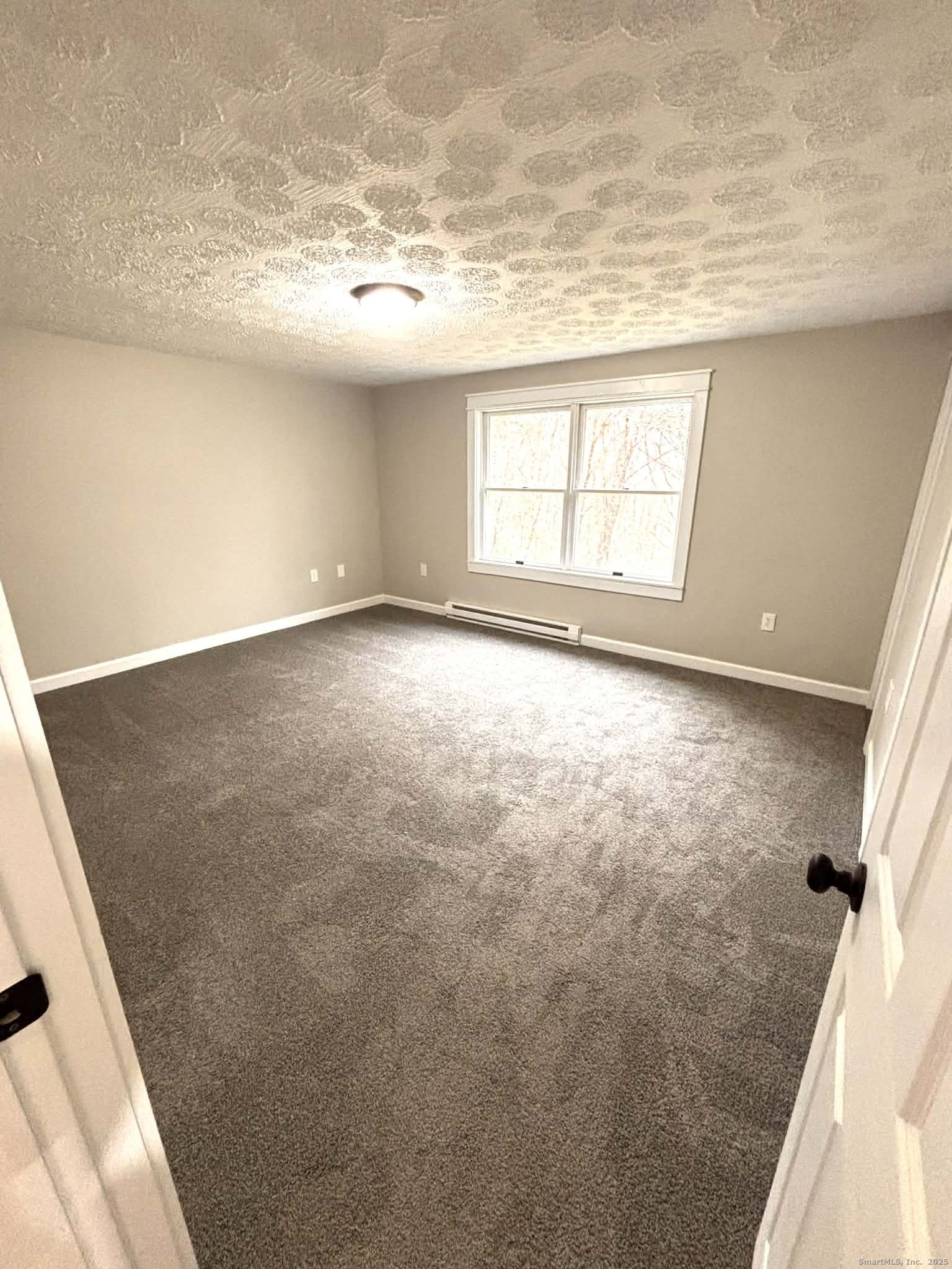 164 Starkweather Road Plainfield, CT 06354 - Photo 7 of 23 view of an empty room with a window