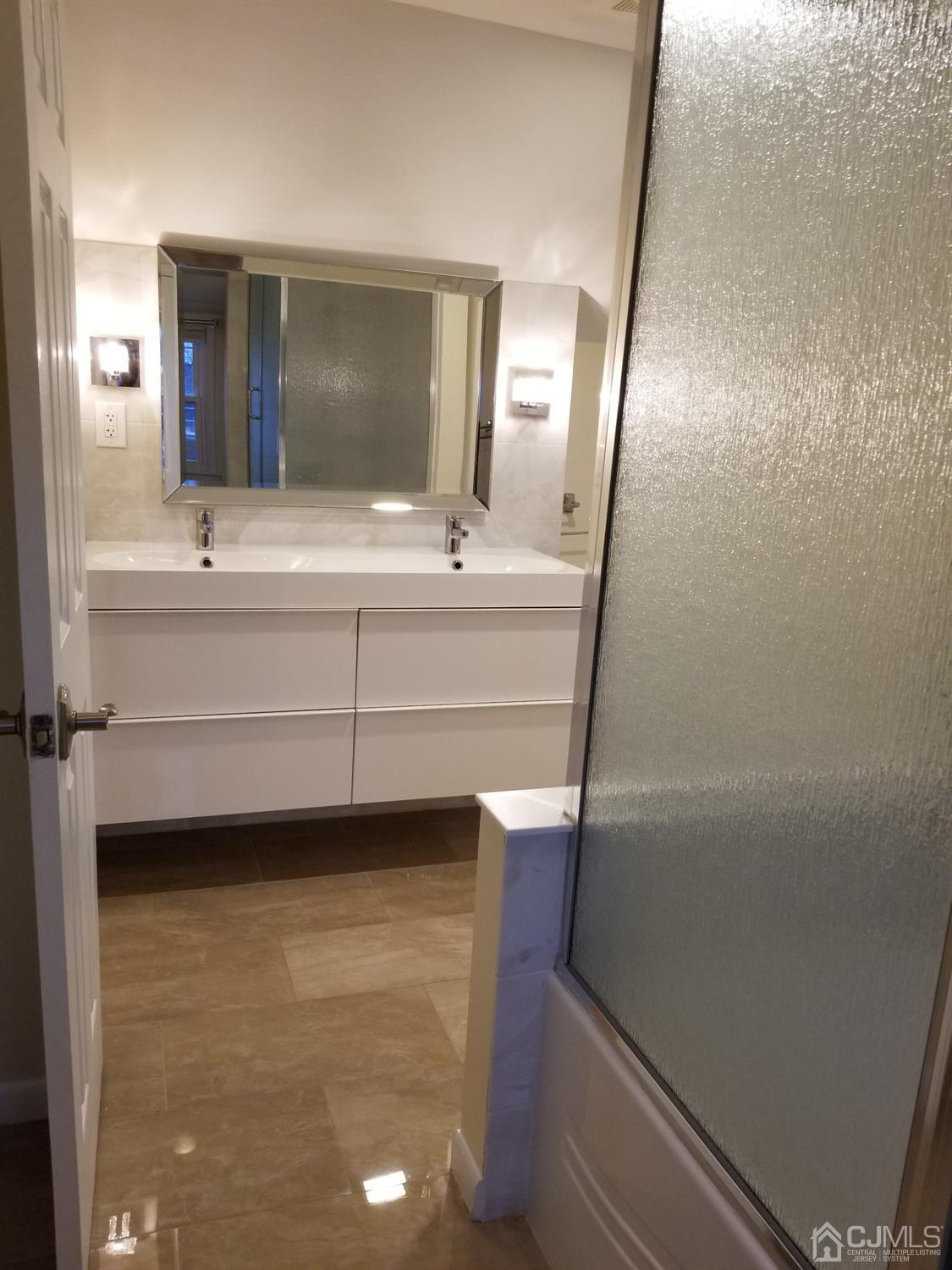 1551 Barton Road Union, NJ 07083 - Photo 5 of 7 a bathroom with a sink and a mirror