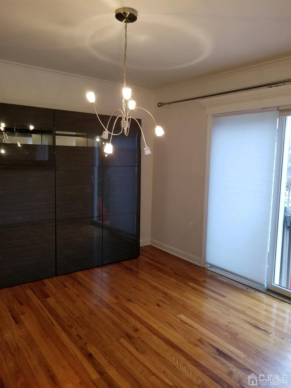 1551 Barton Road Union, NJ 07083 - Photo 6 of 7 a view of empty room with wooden floor