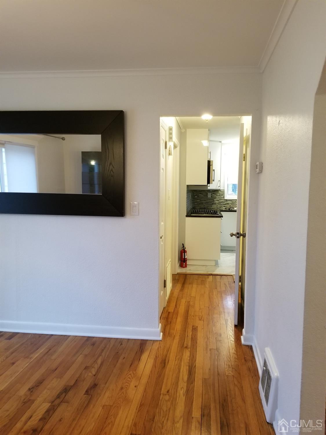1551 Barton Road Union, NJ 07083 - Photo 7 of 7 a view of a hallway with wooden floor