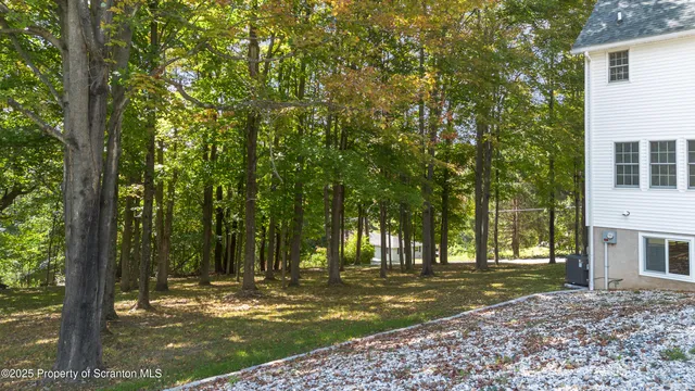 a view of a livingroom with workspace and a window