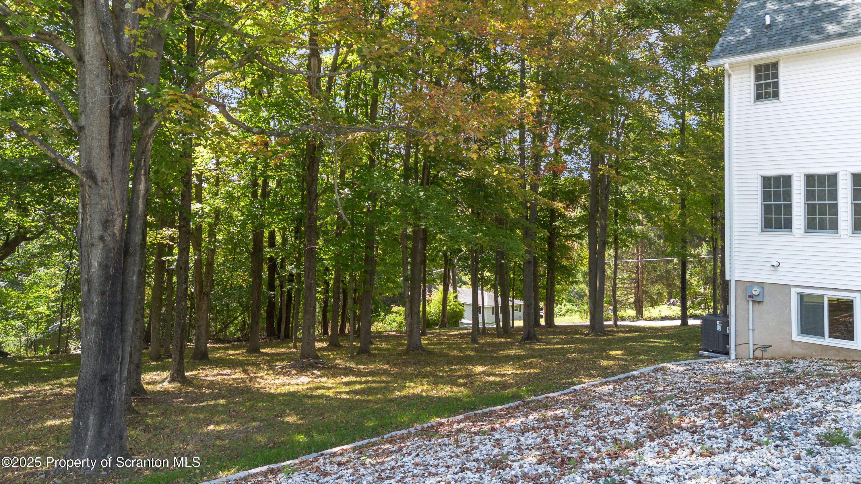 220 Fuller Road Dalton, PA 18414 - Photo 12 of 55 a view of a yard in front of a house