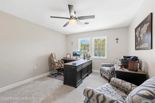 a bedroom with a large bed and a large window