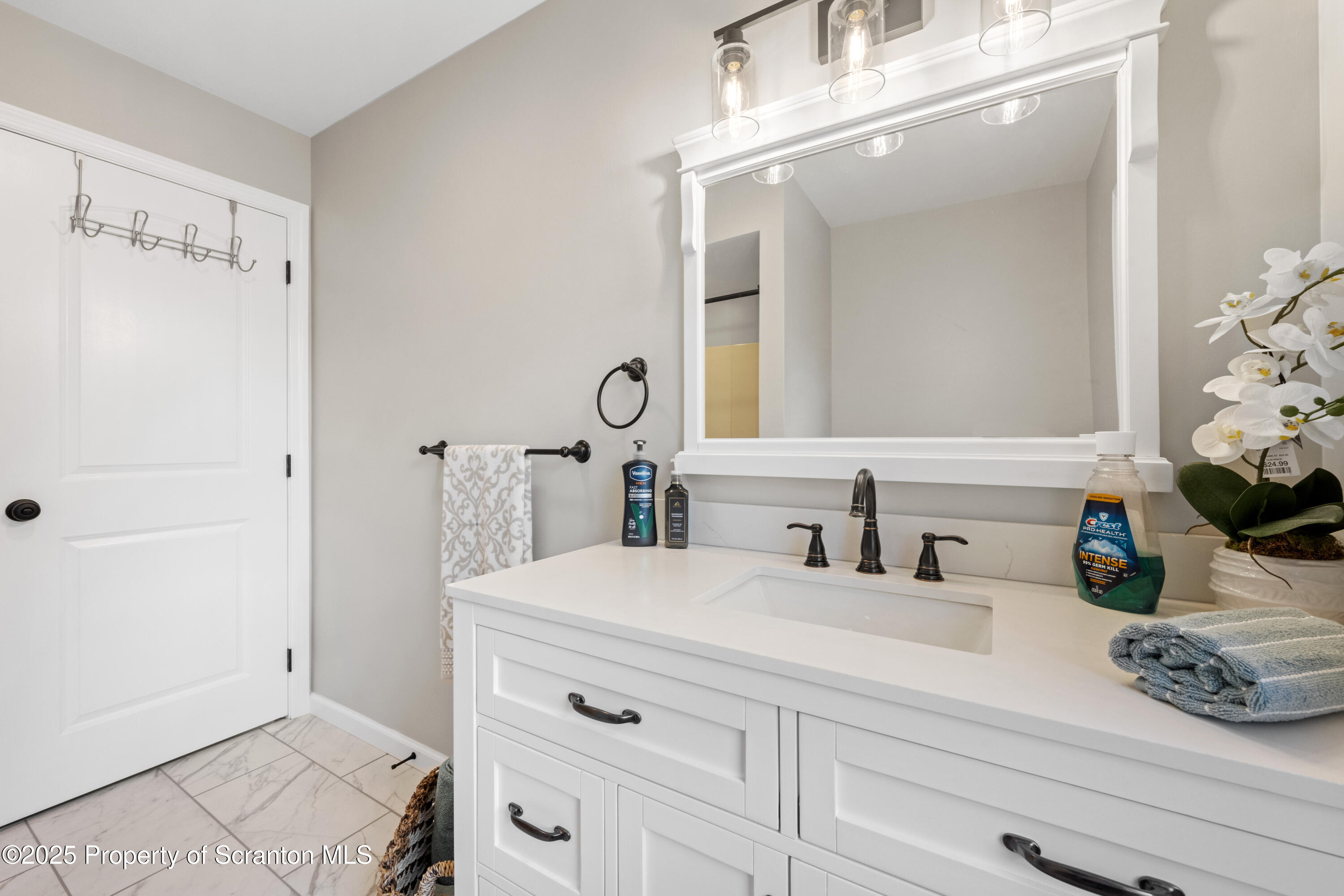 220 Fuller Road Dalton, PA 18414 - Photo 19 of 55 a bathroom with a sink and a mirror