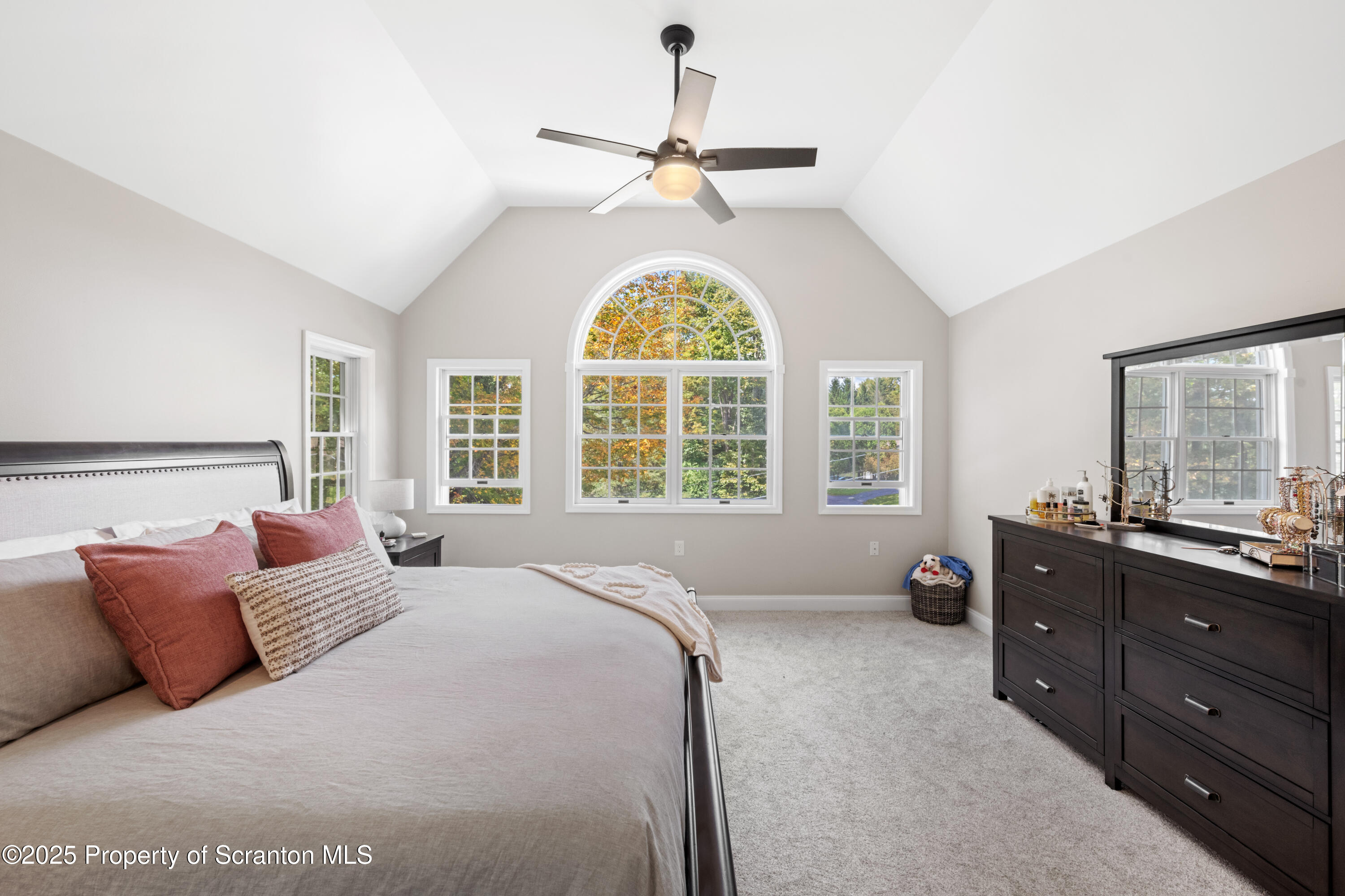 220 Fuller Road Dalton, PA 18414 - Photo 22 of 55 a spacious bedroom with a bed and a large window