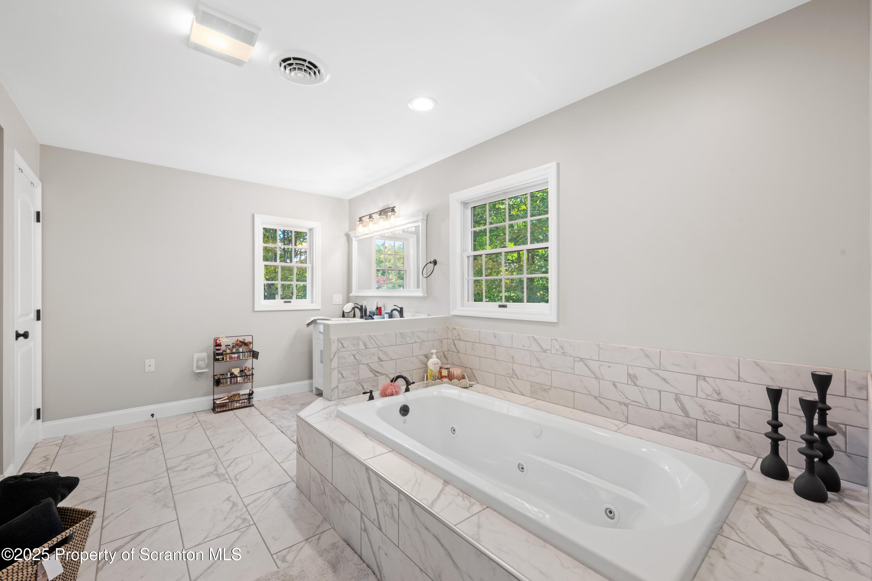 220 Fuller Road Dalton, PA 18414 - Photo 23 of 55 a bathroom with a bathtub and a window