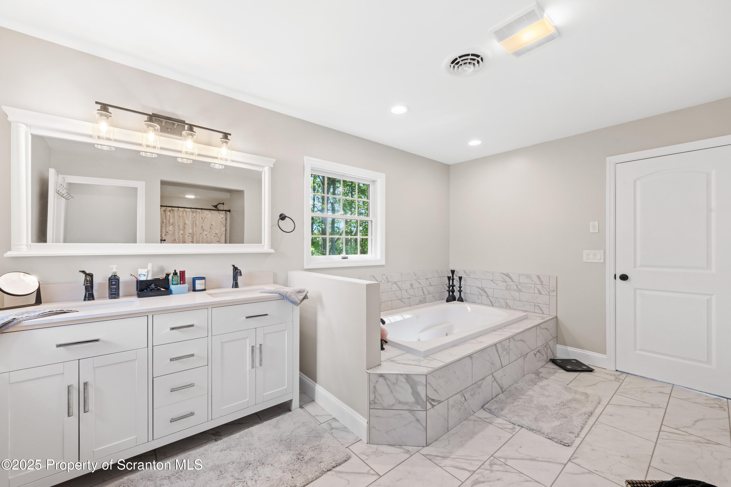 220 Fuller Road Dalton, PA 18414 - Photo 25 of 55 a bathroom with a granite countertop sink and a mirror