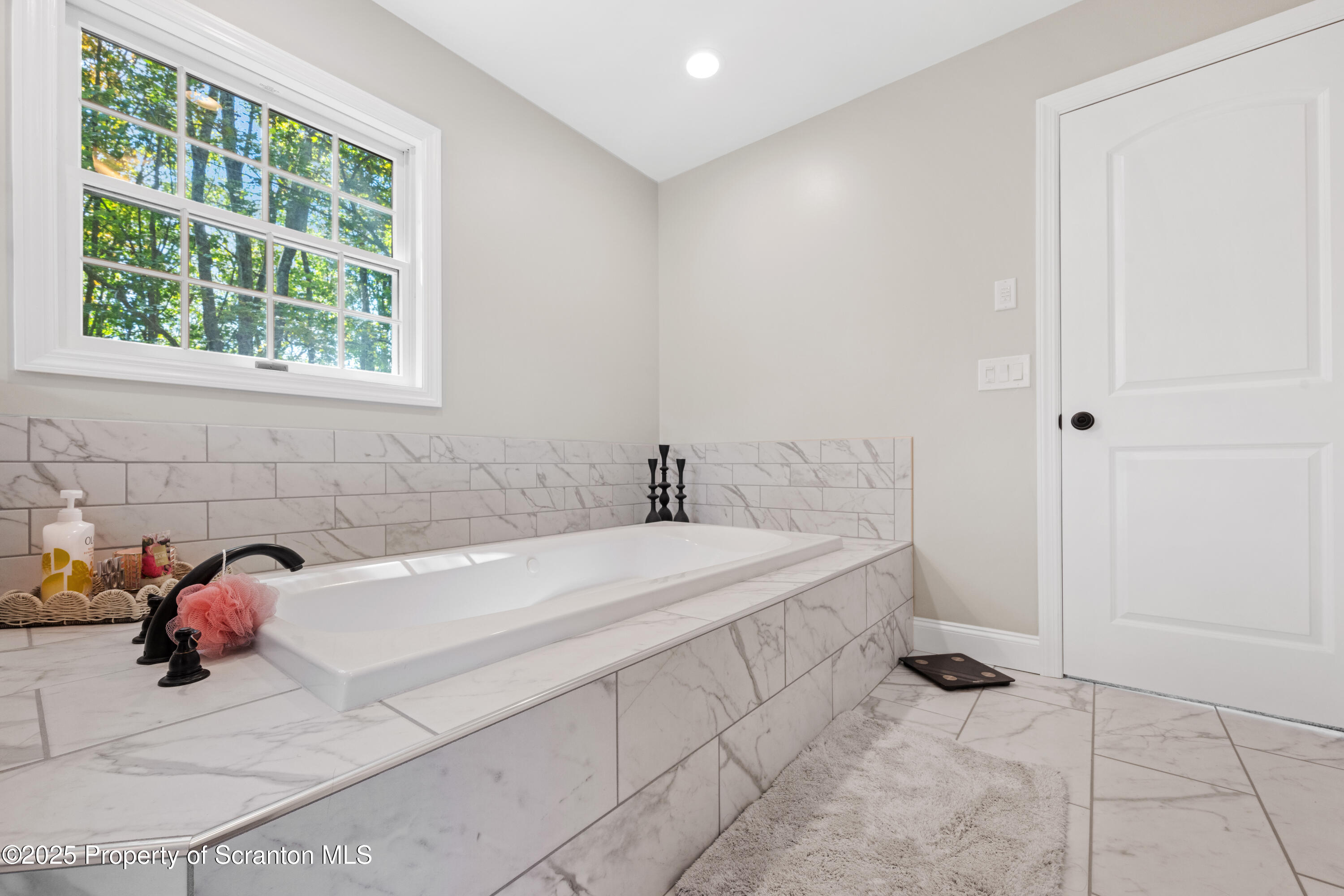 220 Fuller Road Dalton, PA 18414 - Photo 26 of 55 a spacious bathroom with a sink and a bathtub