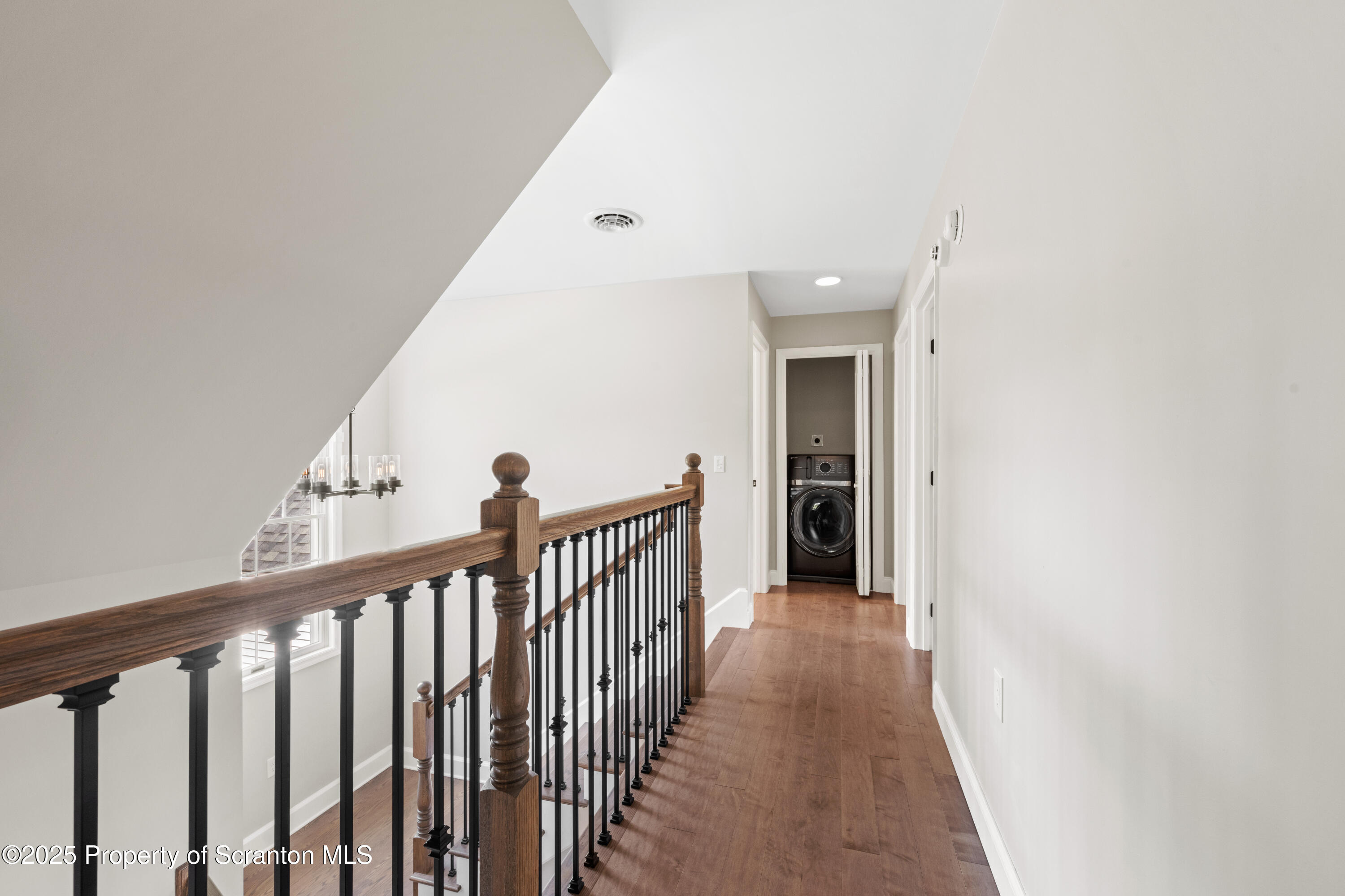 220 Fuller Road Dalton, PA 18414 - Photo 27 of 55 a view of a hallway with wooden floor and entryway