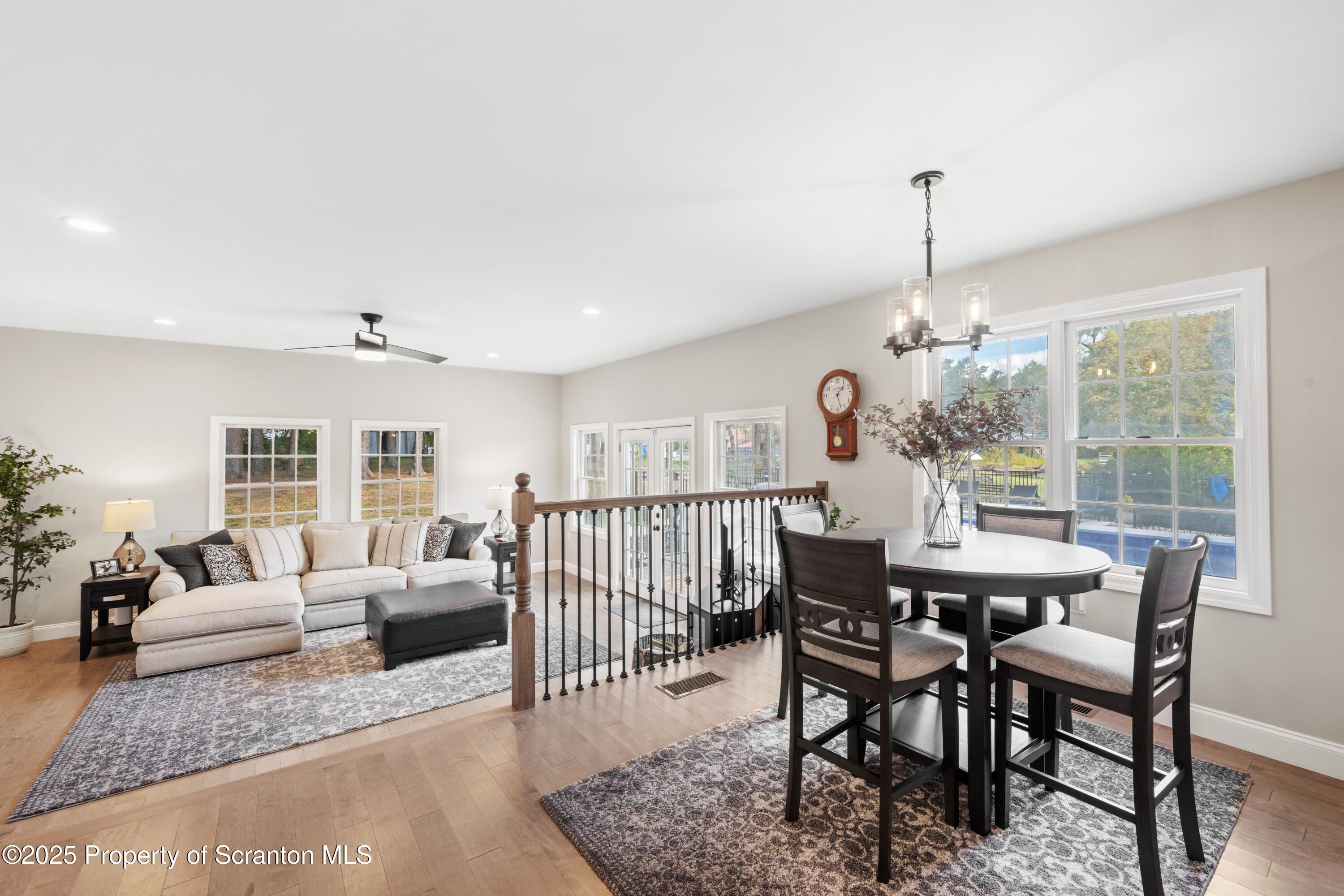 220 Fuller Road Dalton, PA 18414 - Photo 36 of 55 a view of a dining room and livingroom with furniture wooden floor a chandelier