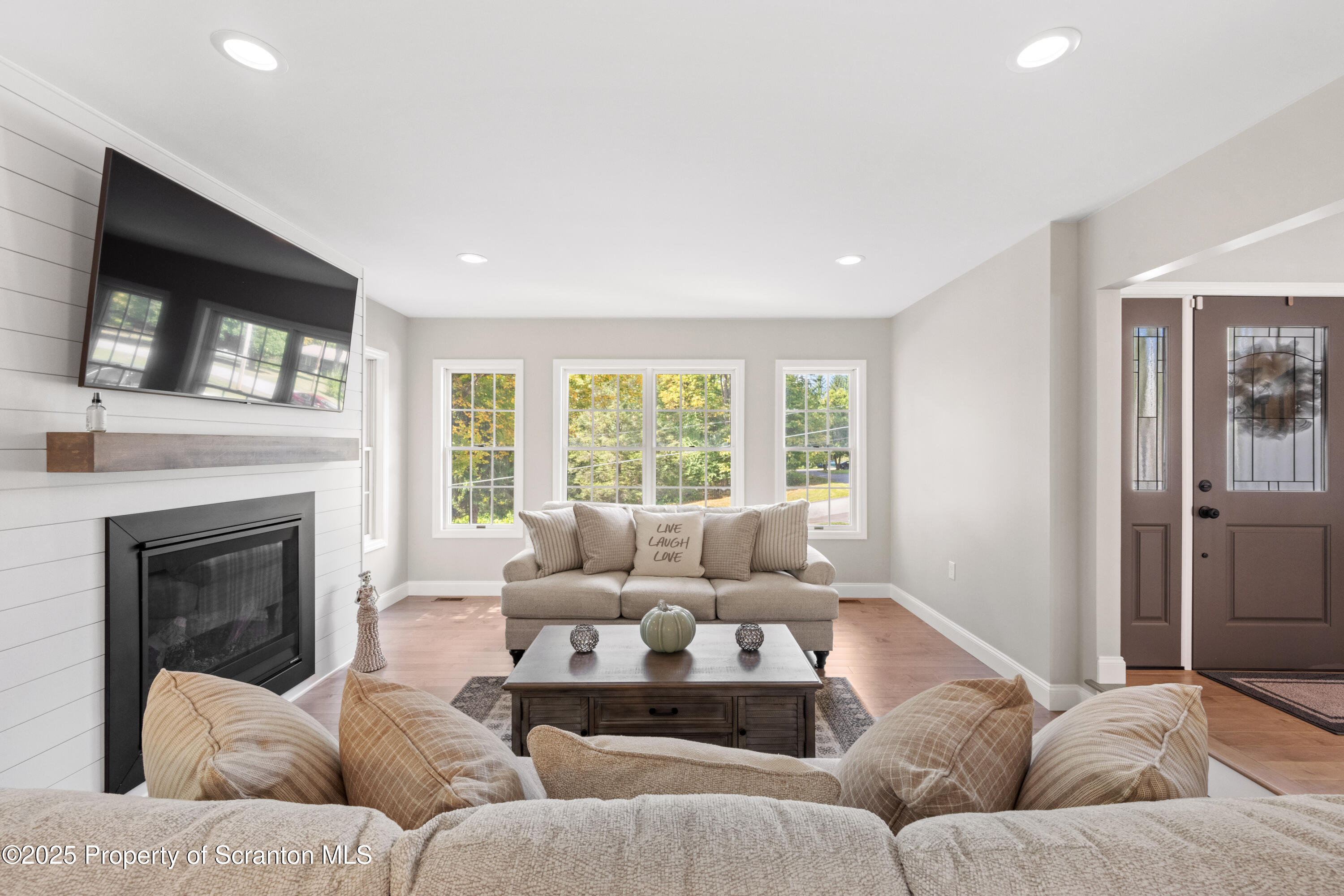220 Fuller Road Dalton, PA 18414 - Photo 42 of 55 a living room with furniture and a fireplace