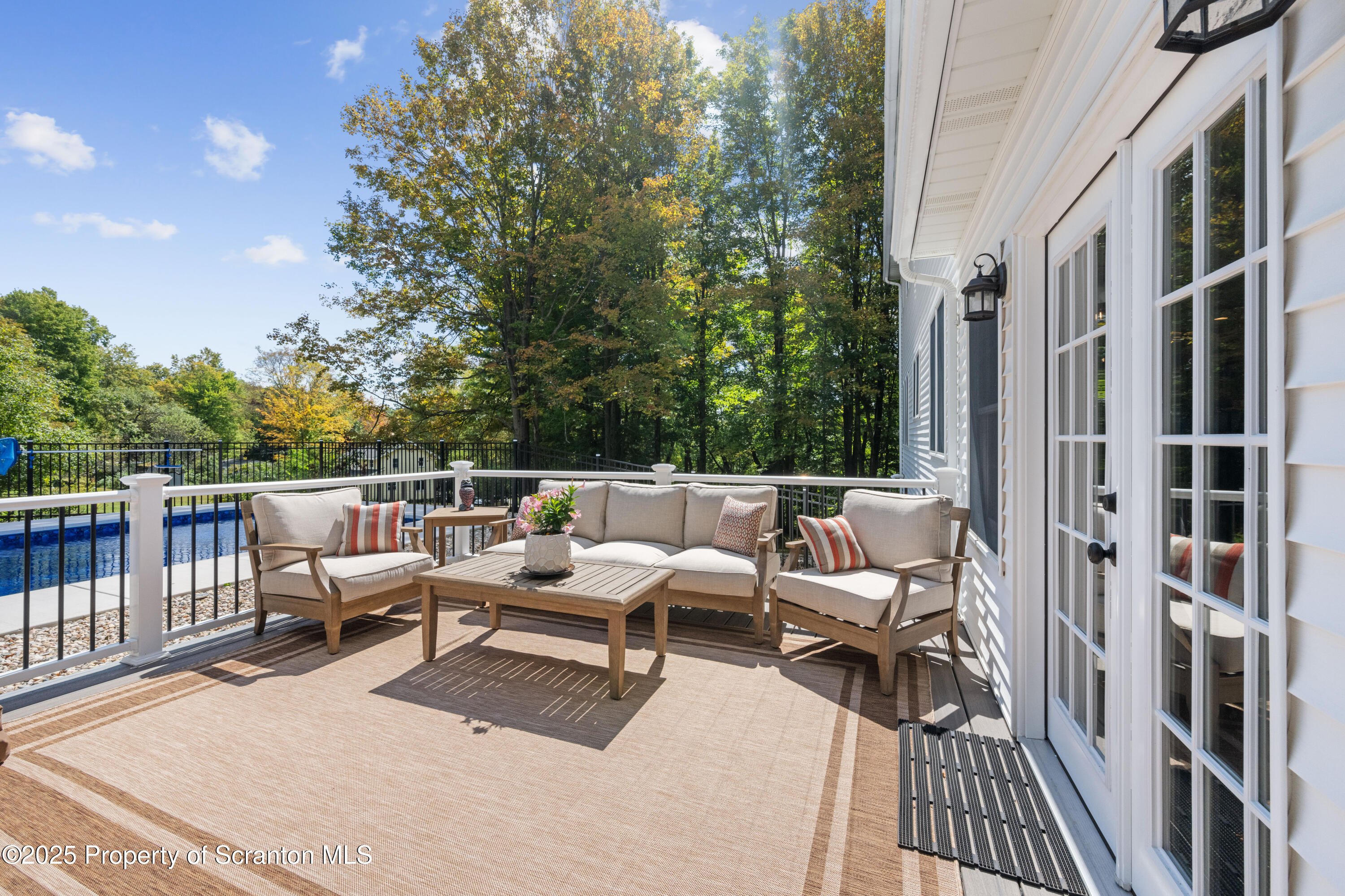 220 Fuller Road Dalton, PA 18414 - Photo 52 of 55 a wooden bench sitting in front of a building