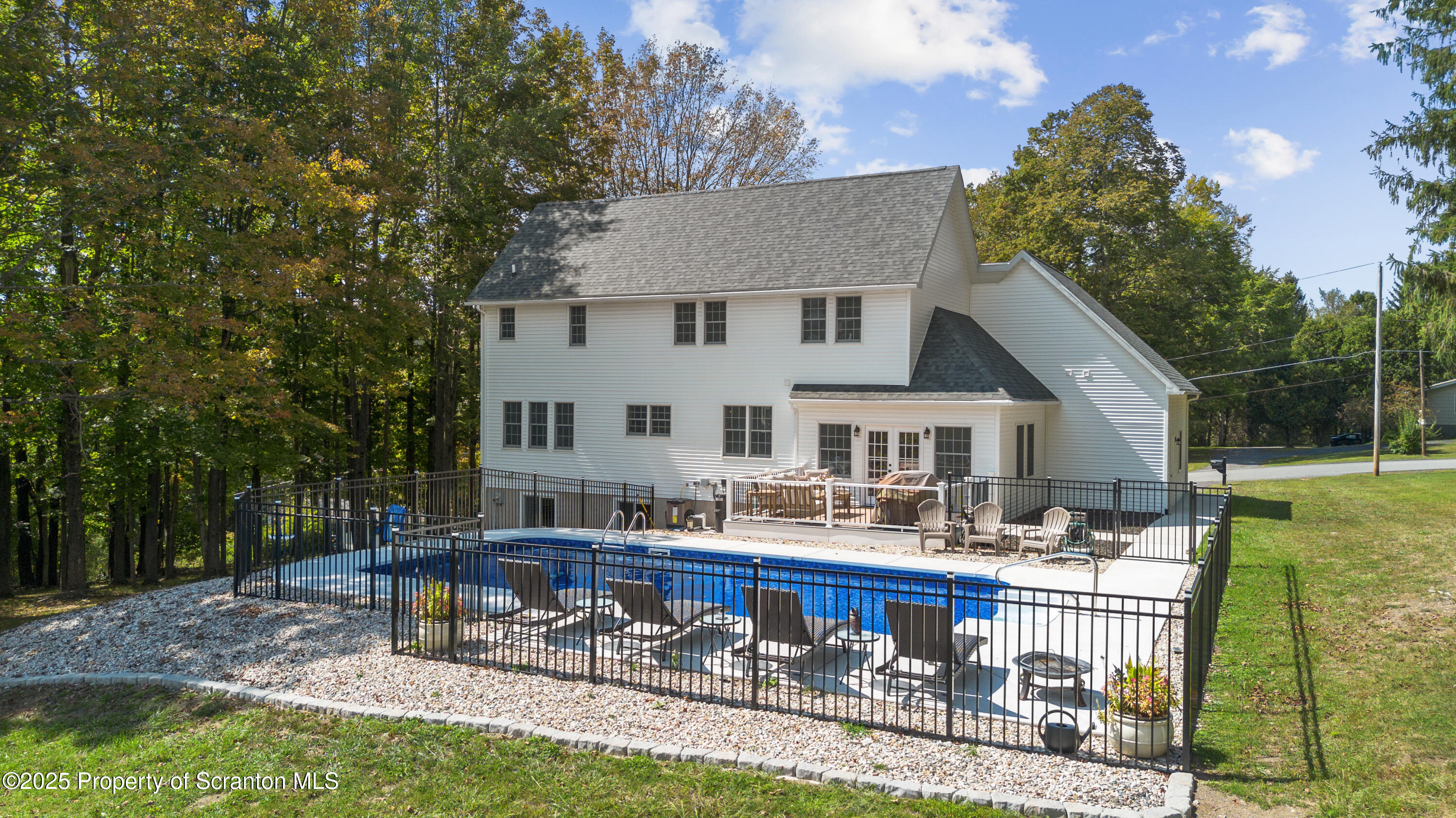 220 Fuller Road Dalton, PA 18414 - Photo 10 of 55 a view of a house with backyard sitting area and garden
