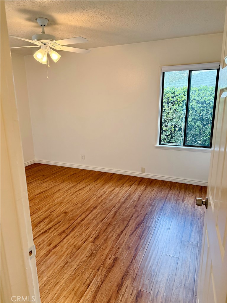 18424 Calvert Street Tarzana, CA 91335 - Photo 11 of 25 a view of a room with wooden floor and white walls