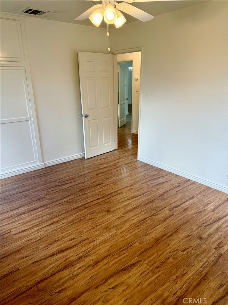18424 Calvert Street Tarzana, CA 91335 - Photo 12 of 25 wooden floor in an empty room