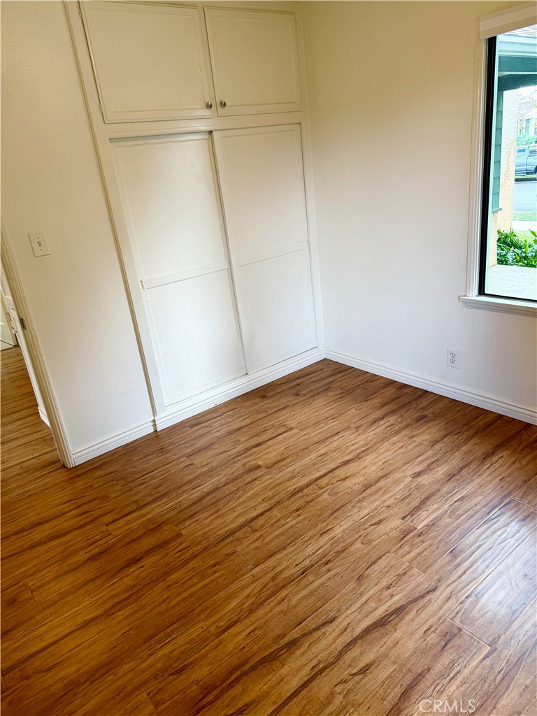 18424 Calvert Street Tarzana, CA 91335 - Photo 15 of 25 a view of empty room with wooden floor
