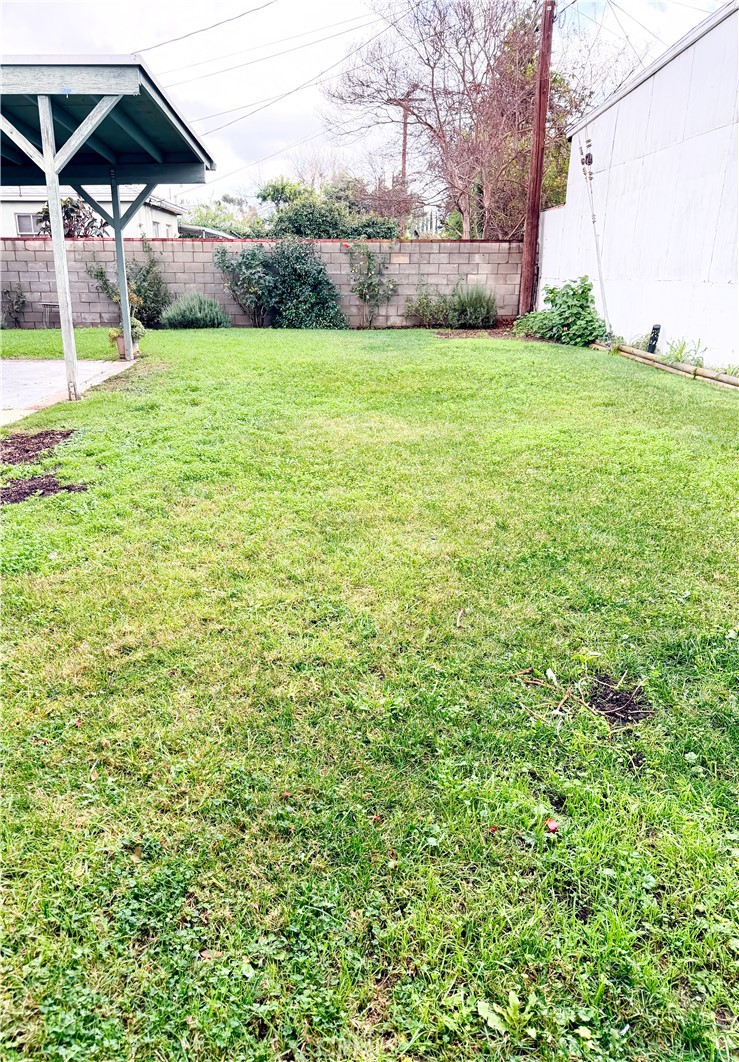 18424 Calvert Street Tarzana, CA 91335 - Photo 17 of 25 a view of a backyard