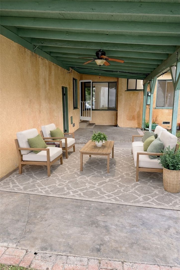 18424 Calvert Street Tarzana, CA 91335 - Photo 18 of 25 a living room with furniture and a potted plant