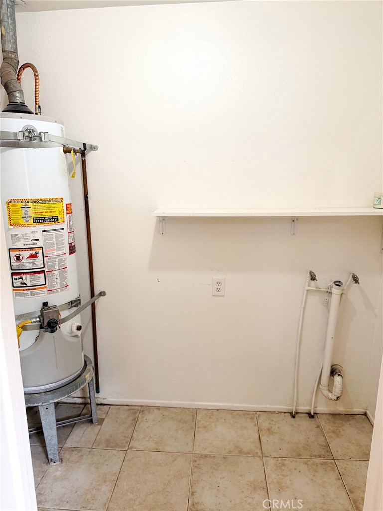 18424 Calvert Street Tarzana, CA 91335 - Photo 23 of 25 a utility room with dryer and washer