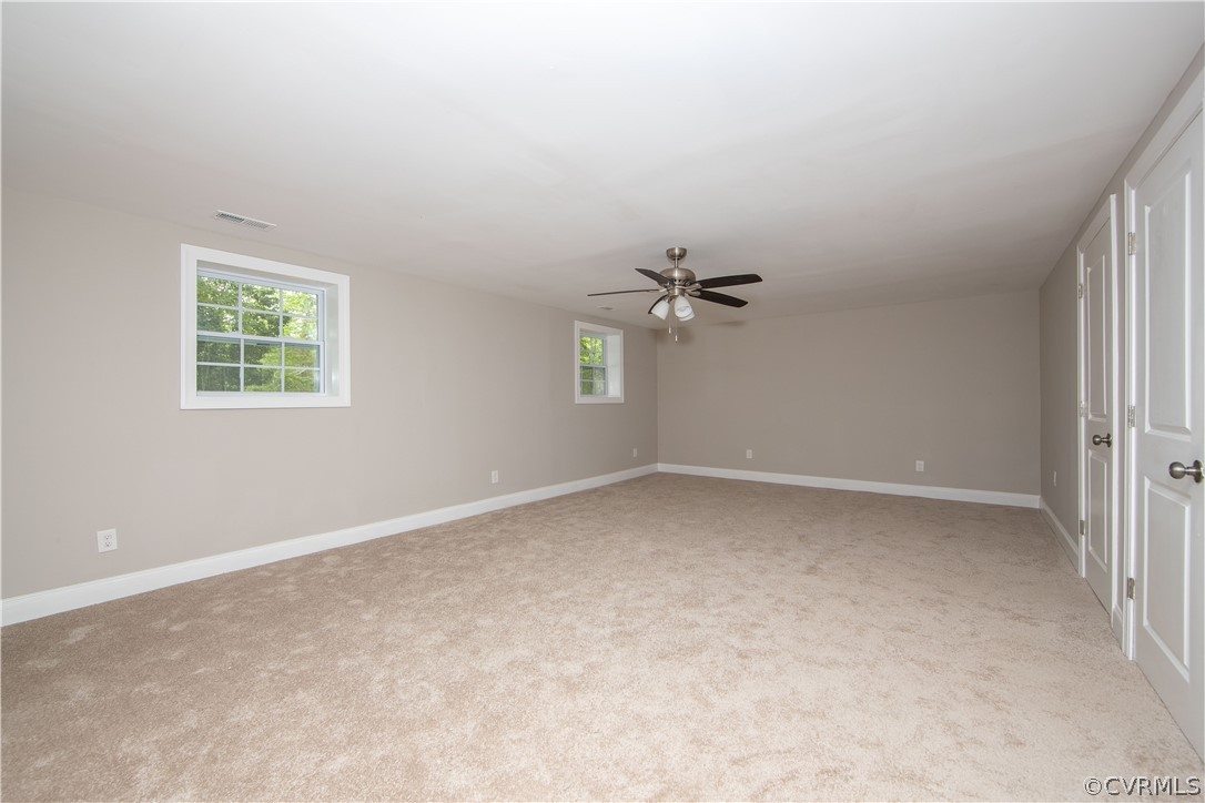 4352 Three Bridge Road Powhatan, VA 23139 - Photo 16 of 30 Living room with new carpet and ceiling fan