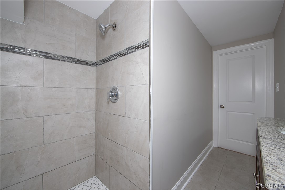 4352 Three Bridge Road Powhatan, VA 23139 - Photo 24 of 30 Beautiful tiled shower, tile floor and granite cou