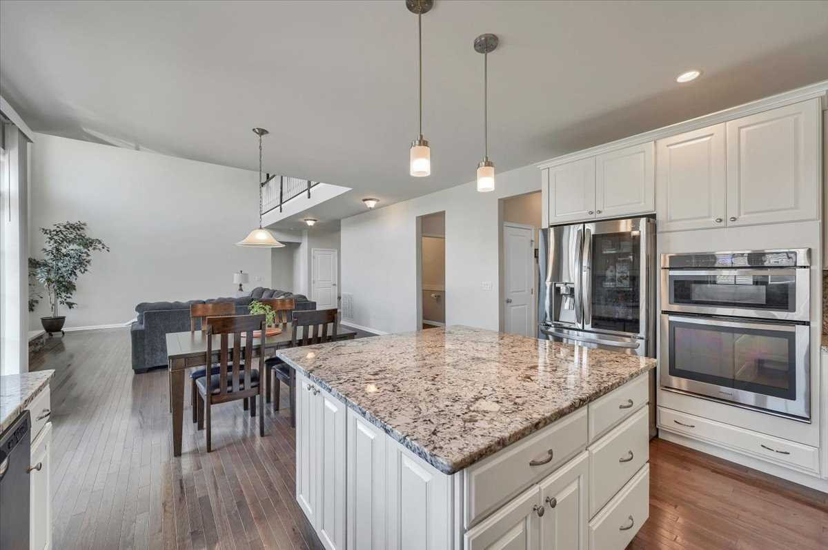41 Pitcher Road East Fishkill, NY 12533 - Photo 12 of 35 a kitchen with a table chairs refrigerator and microwave