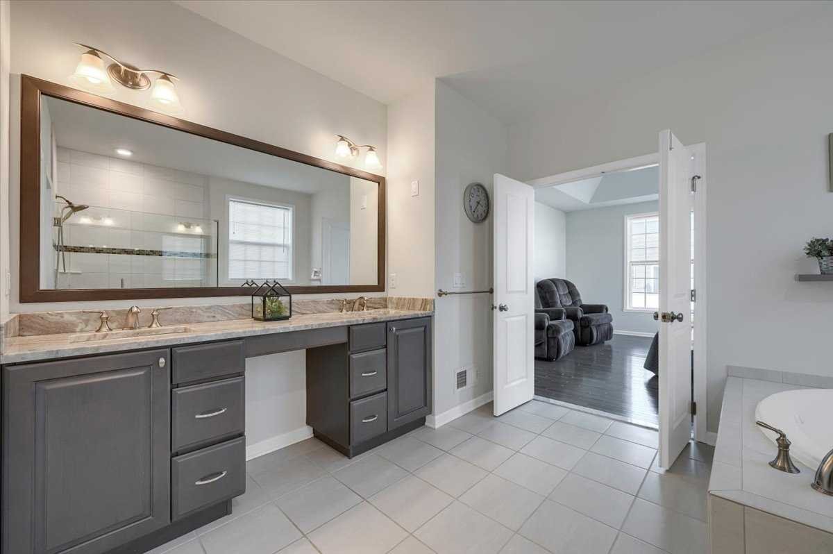 41 Pitcher Road East Fishkill, NY 12533 - Photo 18 of 35 a spacious bathroom with a granite countertop sink a mirror and a
