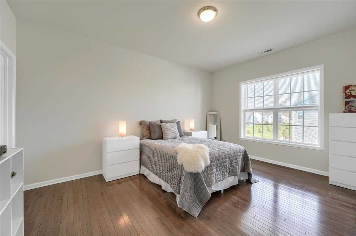 41 Pitcher Road East Fishkill, NY 12533 - Photo 25 of 35 a bedroom with a bed and a large window