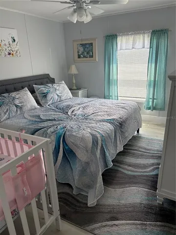 a bedroom with a bed and window