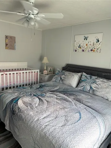 a spacious bedroom with a bed and furniture