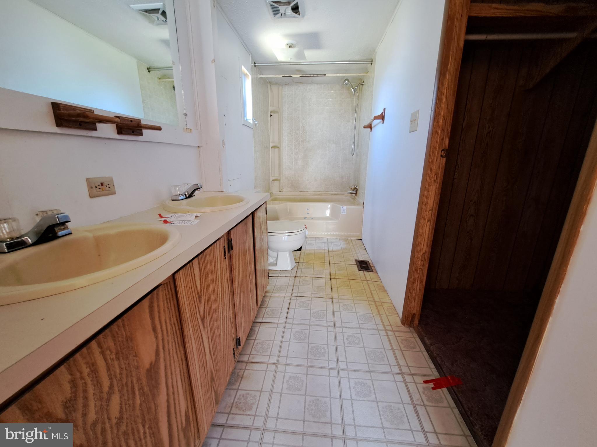 6706 Whiteley Road Hurlock, MD 21643 - Photo 17 of 45 a bathroom with a sink a toilet and shower