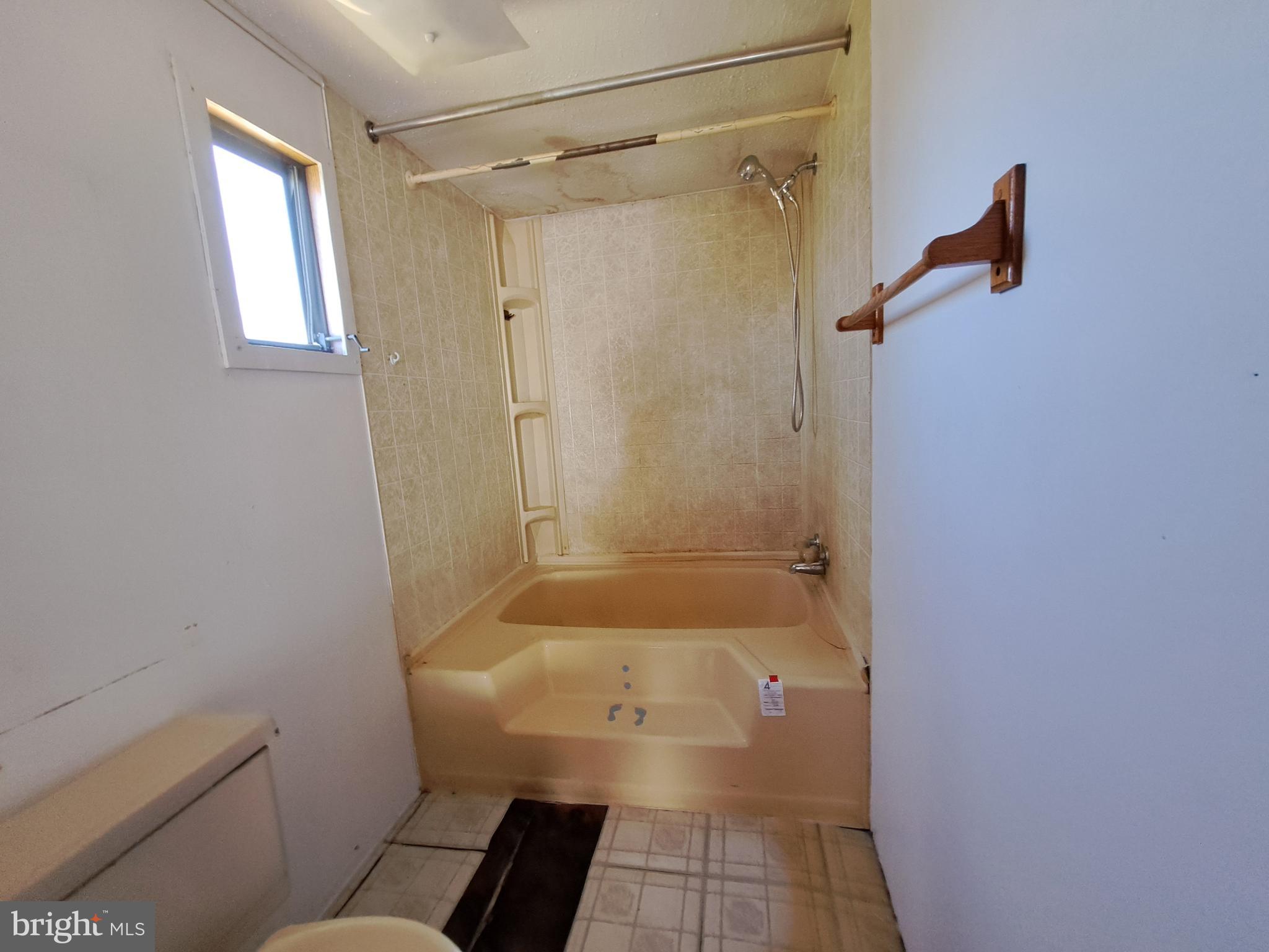 6706 Whiteley Road Hurlock, MD 21643 - Photo 19 of 45 a bathroom with a shower and a toilet