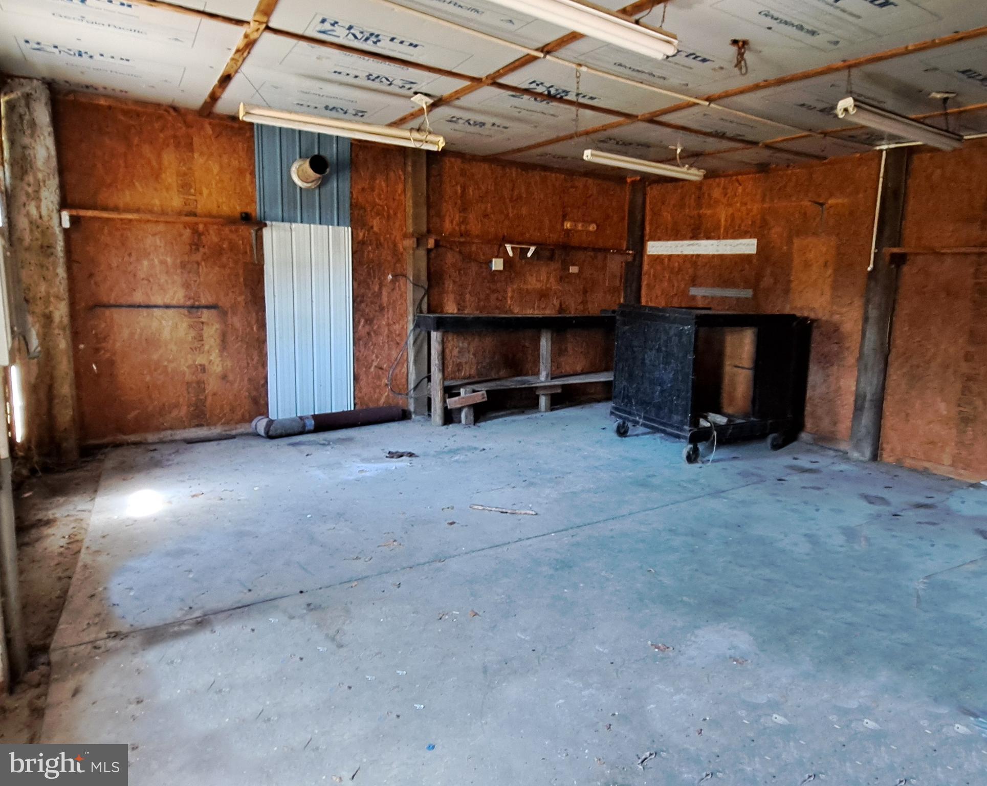 6706 Whiteley Road Hurlock, MD 21643 - Photo 37 of 45 a view of a room with wooden walls